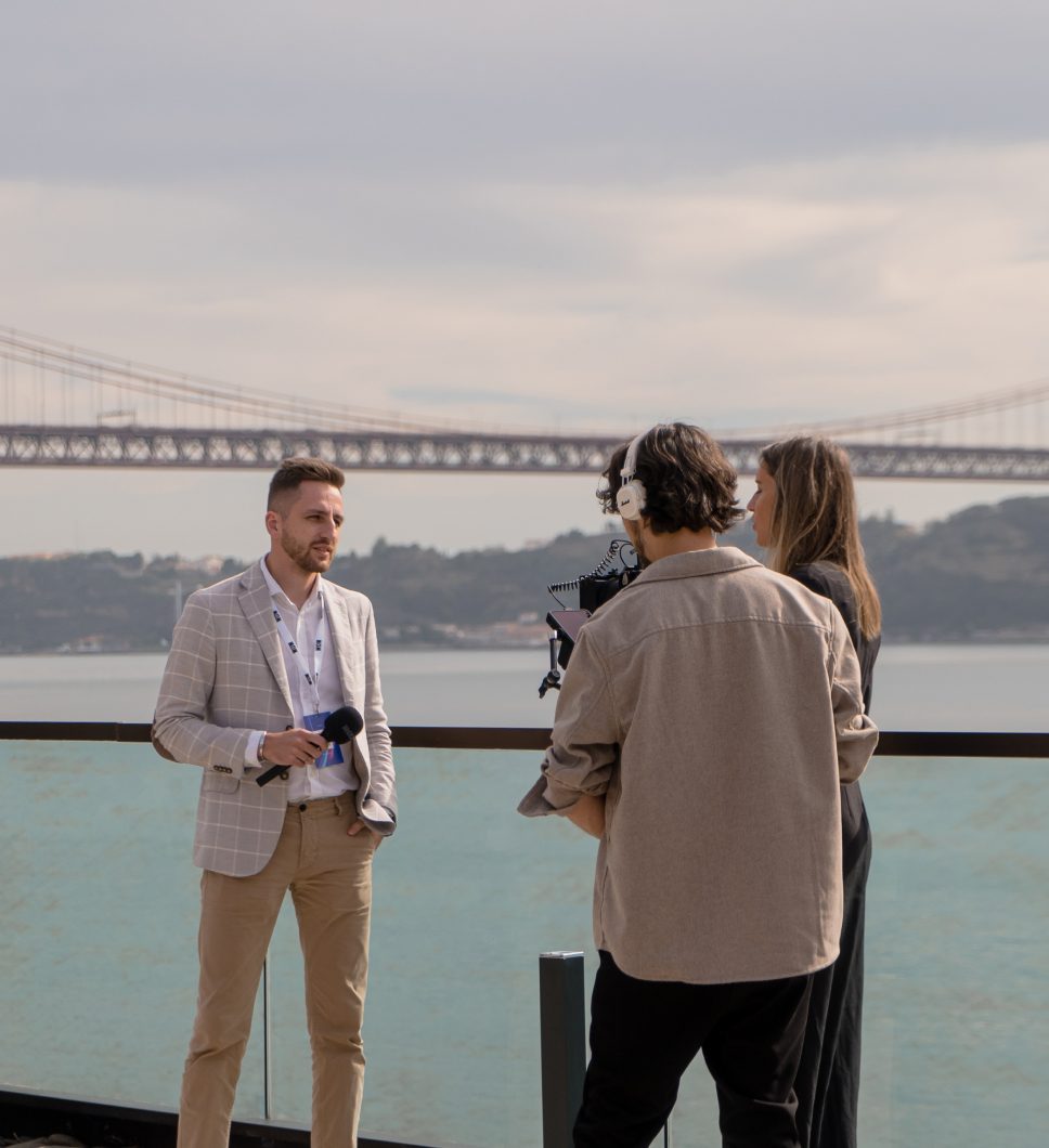 An interview on a terrace by the 25 de Abril bridge, Lisbon