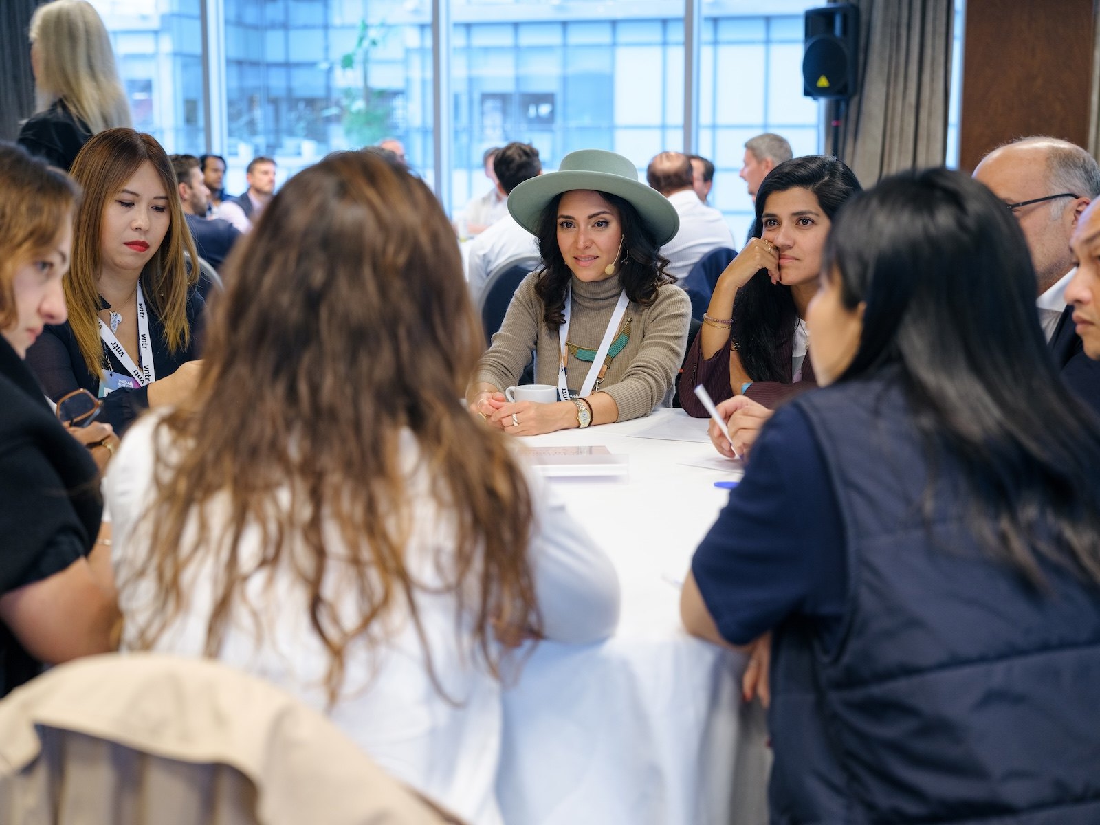 Investors in conversation around a table at a VNTR event